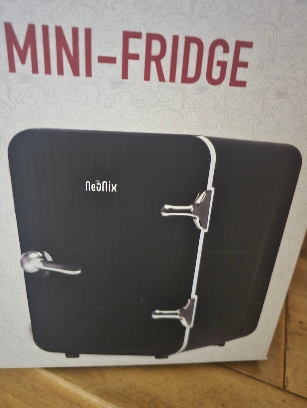 Mini fridge includes car and home adapter. New in box (About 6 Soda Cans)